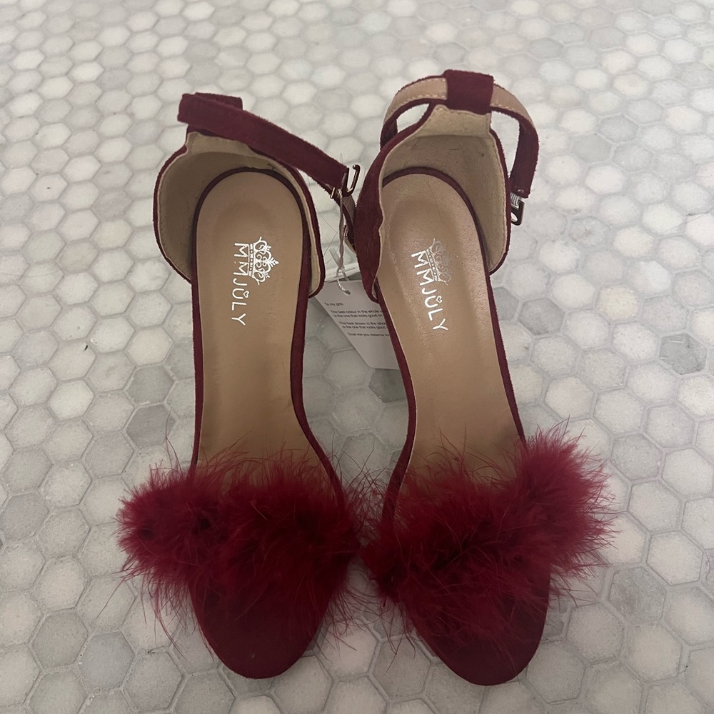 Red feathered heels